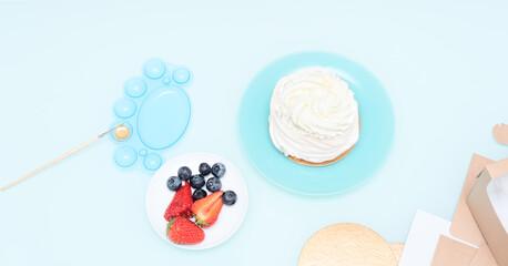 Ingredients for Pavlova cake: strawberries, blueberries and meringue with selective focus. Homemade pastry, delicious sweets concept