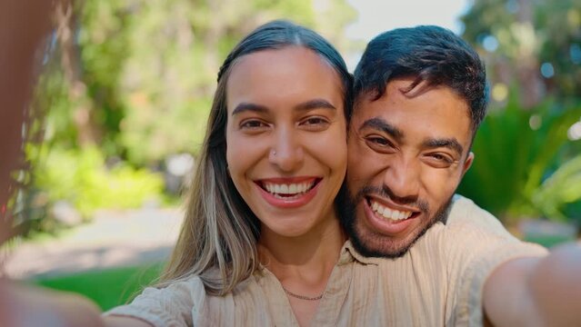 Selfie, love and happy interracial couple in park for bonding, quality time and relax on weekend date. Relationship, dating and portrait of man and woman take picture for memories, post and smile
