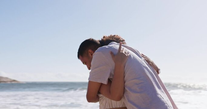 Greeting, hug and a couple at the beach for a date, surprise and fun at the sea. Happy, hello and a man hugging a woman with affection after missing in a long distance relationship at the ocean
