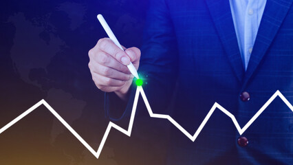 Businessman drawing growth curve, growth forecast chart, bussiness success concept. Hand drawing a graph representing increasing profits.