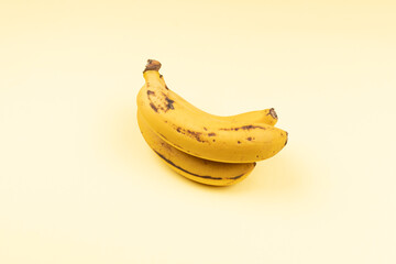 Bunch of realistic bananas from the canary islands isolated on yellow background