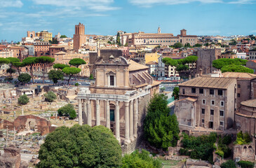 Fototapeta na wymiar Amazing aerial view of the ruins of the famous Roman Forum (Foro Romano) on a sunny day in Rome, Italy