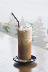 Ice Mocha coffee on wooden table in the cafe.