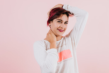 portrait of young latin woman on coral pink background in Mexico Latin America, hispanic people