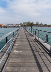 Fototapeta na wymiar Long pontoon floating bridge In Venice, Italy