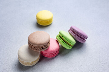 Pile of Macaroon or Macaron Biscuits on Grey Background
