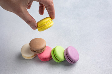 Pile of Macaroon or Macaron Biscuits on Grey Background
