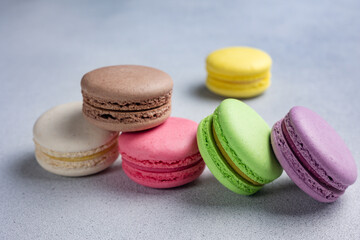 Pile of Macaroon or Macaron Biscuits on Grey Background
