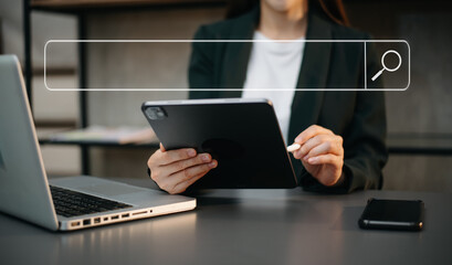 Searching Browsing Internet Data Information Networking Concept with blank search bar. woman working with mobile phone and laptop computer