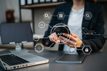 API Application Programming Interface, woman using laptop, tablet and smartphone with virtual screen API icon Software development tool, modern technology concept..