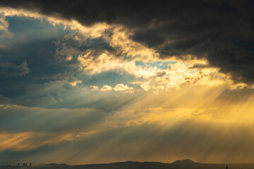 Pipes of a nuclear power plant on the background of a  dramatic sky