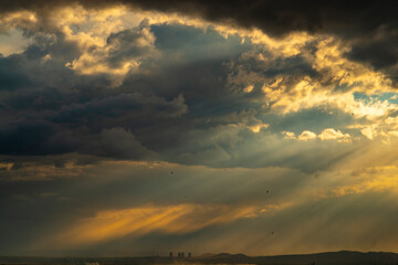 Pipes of a nuclear power plant on the background of a  dramatic sky