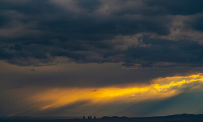 Pipes of a nuclear power plant on the background of a  dramatic sky