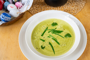 Spring soup from bear garlic and nettle, easter egg.