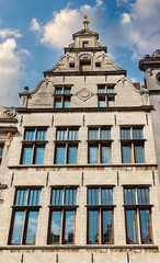 Facades of medieval houses with tiled roofs in the center of Bruggegge