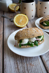 Sandwiches with mozzarella and ham. on a wooden background