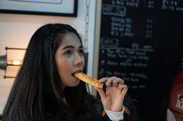 woman eating a churros