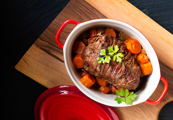 Food concept homemade organic Veal Pot Roast Braised on black background with copy space
