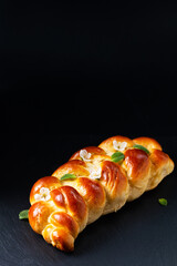 Food concept Spot focus bread braided Challah Bread on black background with copy space