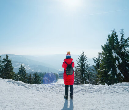 Exploring the majestic beauty of Germanys Black Forest in winter, a lone traveler woman enjoys the breathtaking scenics while taking photos on their holiday trip