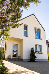 Outside view of a simple white private contemporary house