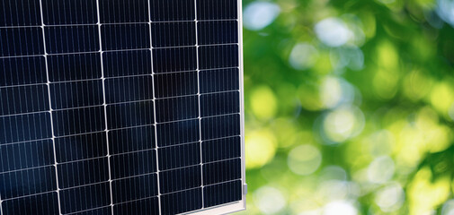 Solar panel with green blurred background	