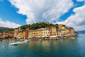 Obraz premium Famous village of Portofino, luxury tourist resort in Genoa Province, Liguria, Italy, Europe. Port and colorful houses, Mediterranean sea (Ligurian sea).