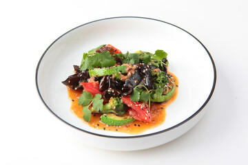 Salad with grilled zucchini and muer mushrooms. Tomatoes, broccoli and parsley in a salad.Healthy vegetarian food. Copy space. Isolated object.