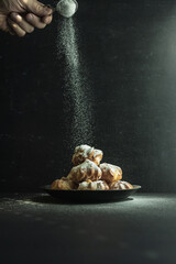cookies and cake on a dark black background
