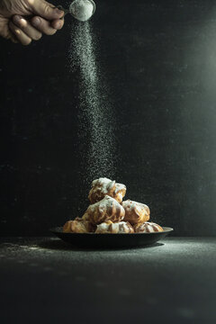 cookies and cake on a dark black background
