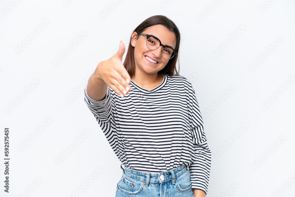 Poster Young caucasian woman isolated on white background shaking hands for closing a good deal