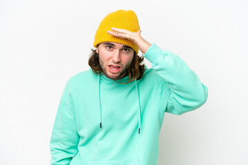 Young handsome man isolated on white chroma background looking far away with hand to look something