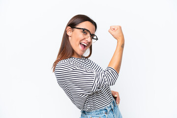 Young caucasian woman isolated on white background doing strong gesture
