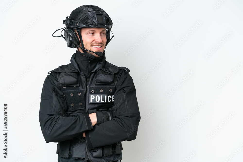 Wall mural SWAT man over isolated white background with arms crossed and happy