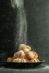 cookies and cake on a dark black background
