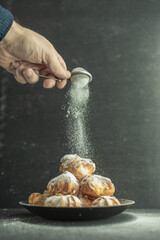 cookies and cake on a dark black background
