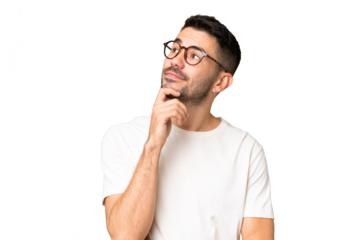 Young handsome caucasian man over isolated chroma key background and looking up