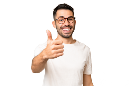 Young handsome caucasian man over isolated chroma key background with thumbs up because something good has happened