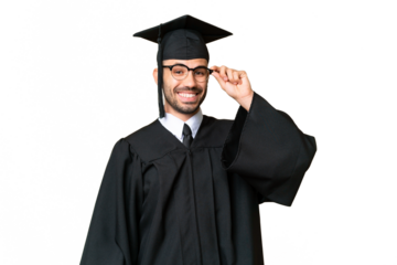Young university graduate man over isolated chroma key background with glasses and surprised