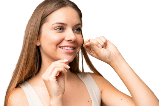 Young blonde woman over isolated chroma key background with dental floss. Close up portrait