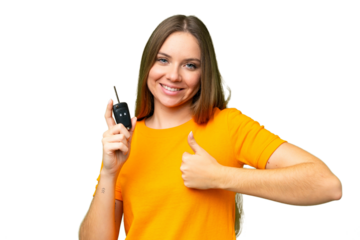 Young woman holding car keys over isolated chroma key background with thumbs up because something good has happened