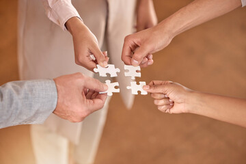 Business people, hands and puzzle piece in planning, teamwork or brainstorming for collaboration at...