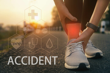 Ankle twist sprain accident in sport exercise running jogging.low key lighting.