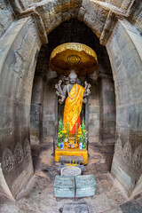 Vertical shot of a Buddha figure at the main Angkor Wat temple complex in Siem Reap, a fisheye view