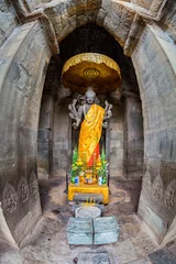 Vlies Fototapete Historisches Monument Vertical shot of a Buddha figure at the main Angkor Wat temple complex in Siem Reap, a fisheye view