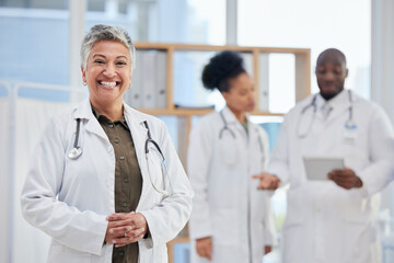 Fototapeta premium Hospital, doctor and portrait of senior woman in healthcare clinic for insurance, wellness and medical service. Medicine, leadership and female health worker smile for professional care and help