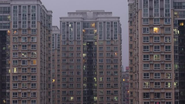 Timelapse of window light of city buildings from day To night, Beijing, China. 