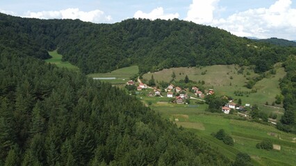Beautiful landscape of an old Bosnian village surrounded by green mountains and rich vegetation