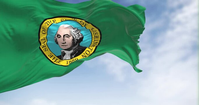 Seamless loop in slow motion of Washington state flag waving on a clear day