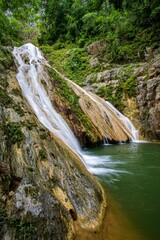 Landscape of Waterfall in Soroa, (Vinales) Pinar del Rio, Cuba with green plants, vertical shot